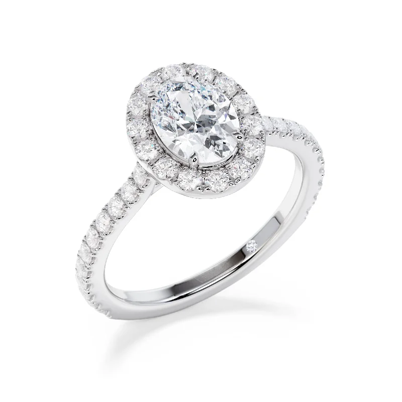 Cushion - cut diamond engagement ring with a halo of moissanite in a silver - plated bandGrosvenor