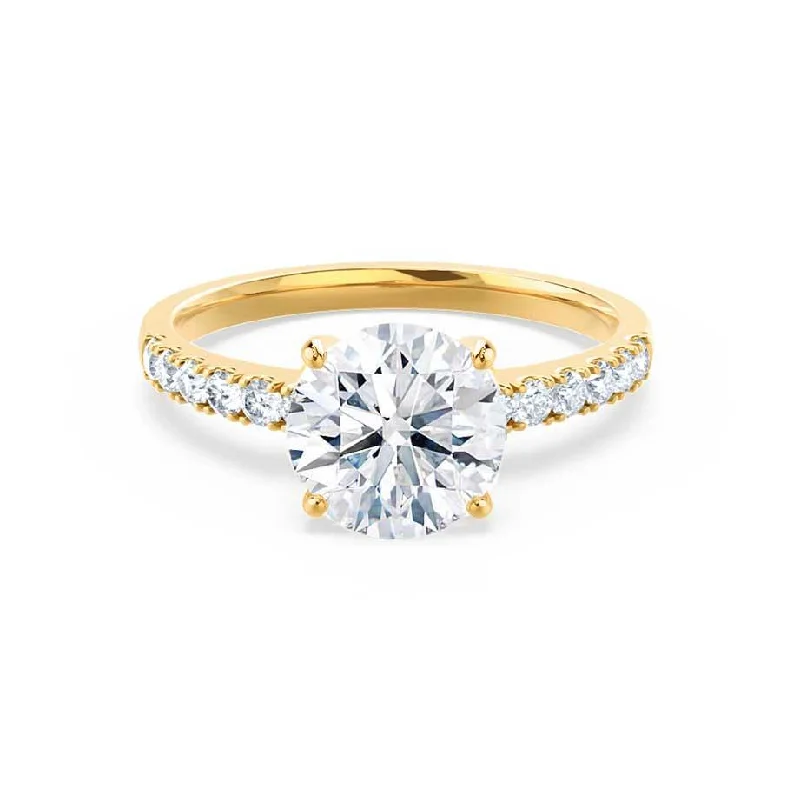 Emerald and diamond engagement ring in a vintage - inspired platinum bandGISELLE - Round Moissanite & Diamond 18k Yellow Gold Solitaire Ring