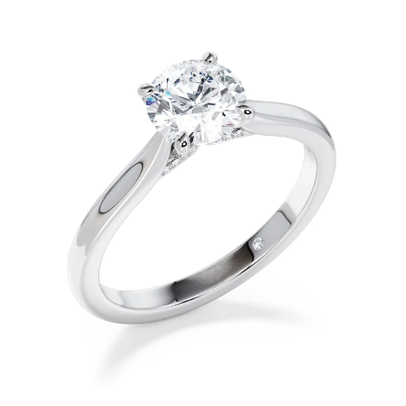 Princess - cut diamond engagement ring with a pavé - set band in platinumClaridge