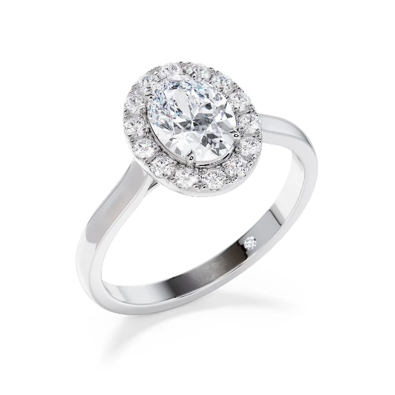 Aquamarine and diamond engagement ring in a 18K white - gold setting with a scalloped edgeKew