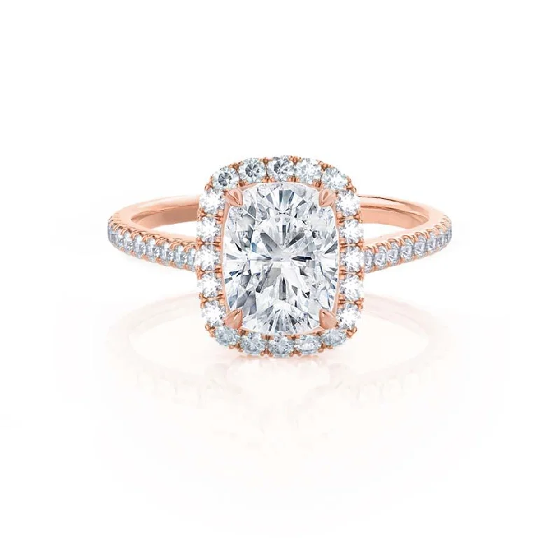 Round - cut diamond engagement ring with a twisted band design in 14K white goldDARLEY - Moissanite Elongated Cushion Micro Pavé 18k Rose Gold Halo