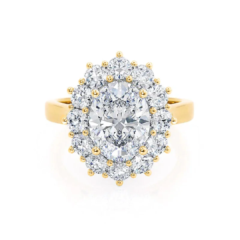 Round - cut diamond engagement ring with a twisted band design in 14K white goldDIANA - Iconic Oval Moissanite & Lab Diamond 18k Yellow Gold