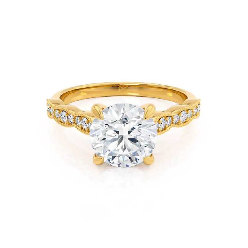 Cushion - cut diamond engagement ring with a halo of moissanite in a silver - plated bandHONOR - Round Moissanite 18k Yellow Gold Shoulder Set Ring