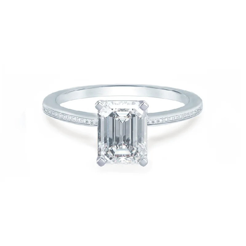 Solitaire diamond engagement ring with a platinum setting for a classic and elegant lookIRIS - Emerald Moissanite 18k White Gold Petite Channel Set Ring