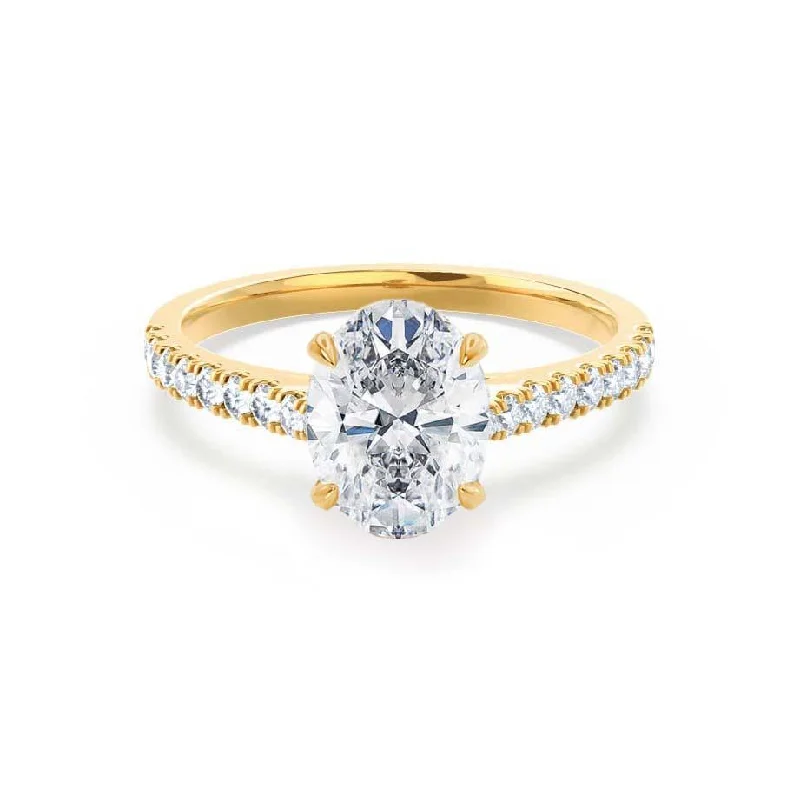 Marquise - cut diamond engagement ring with a split - shank band in platinumVIOLA - Oval Moissanite & Diamond 18k Yellow Gold Shoulder Set Ring