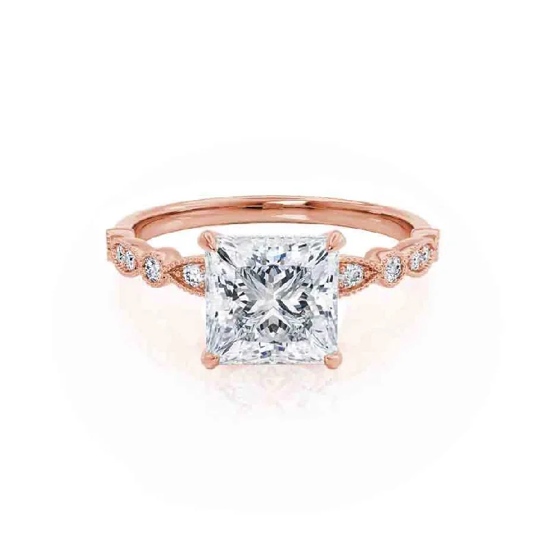 Aquamarine and diamond engagement ring in a 18K white - gold setting with a scalloped edgeHOPE - Princess Moissanite & Diamond 18k Rose Gold Vintage Shoulder Set