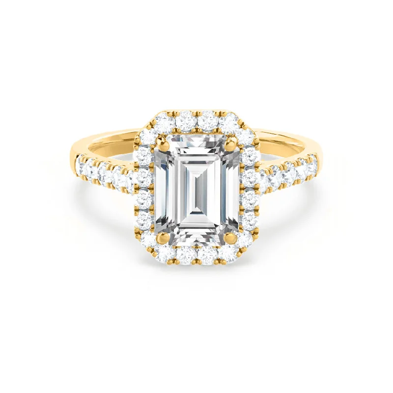 Round - cut diamond engagement ring with a twisted band design in 14K white goldESME - Emerald Moissanite & Diamond 18k Yellow Gold Halo Rings