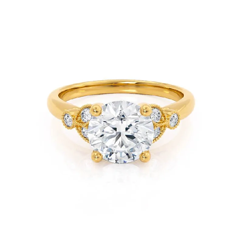 Pear - shaped diamond engagement ring with side baguette diamonds in 18K goldDELILAH - Round Moissanite 18k Yellow Gold Shoulder Set Ring