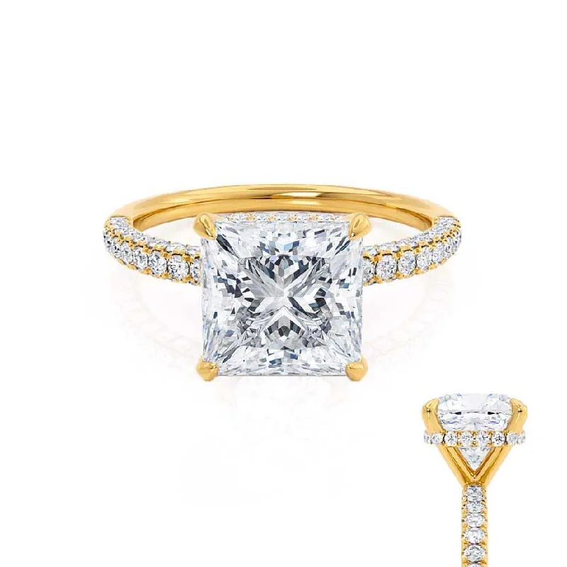 Halo diamond engagement ring in 18K white gold with a center oval - cut stoneCOCO - Princess Moissanite & Diamond 18k Yellow Gold Hidden Halo Triple Pavé Shoulder Set