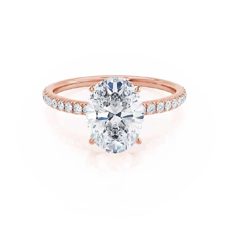 Three - stone diamond engagement ring in rose gold, symbolizing past, present, and futureMACY - Oval Moissanite & Diamond 18k Rose Gold Petite Pavé Ring