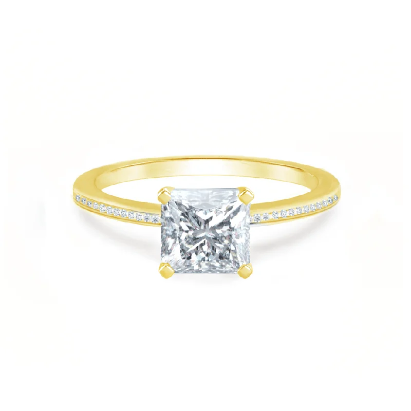 Pear - shaped diamond engagement ring with side baguette diamonds in 18K goldIRIS - Princess Moissanite 18k Yellow Gold Petite Channel Set Ring