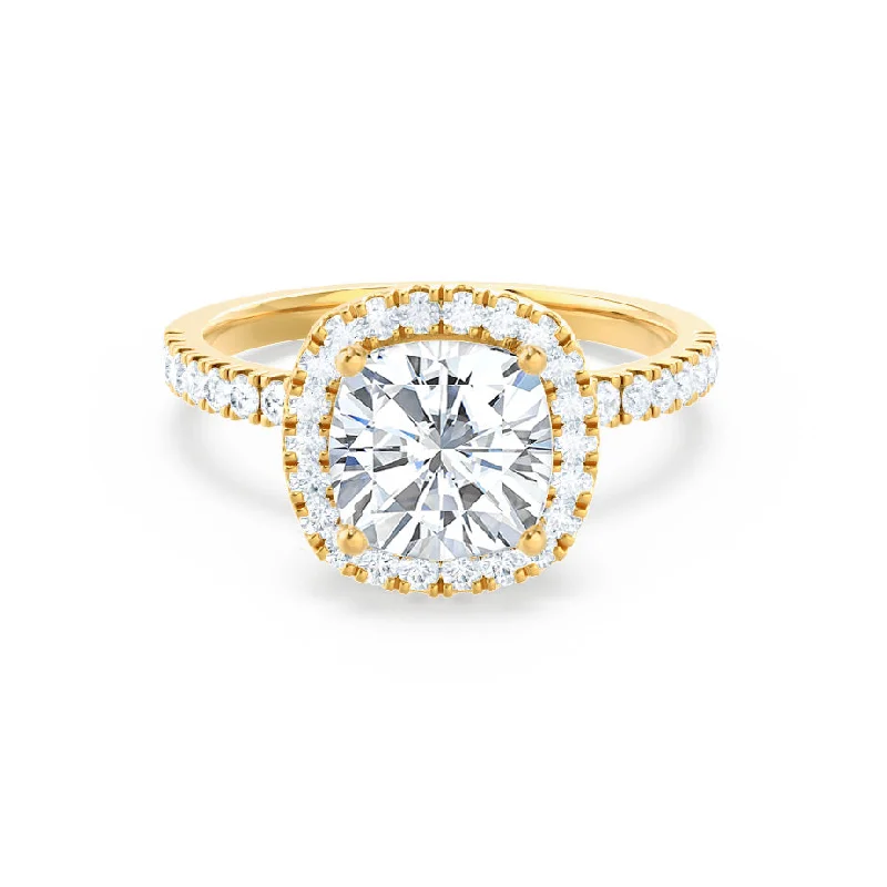 Pear - shaped diamond engagement ring with side baguette diamonds in 18K goldCASEADA - Cushion Moissanite & Diamond 18k Yellow Gold Halo Ring