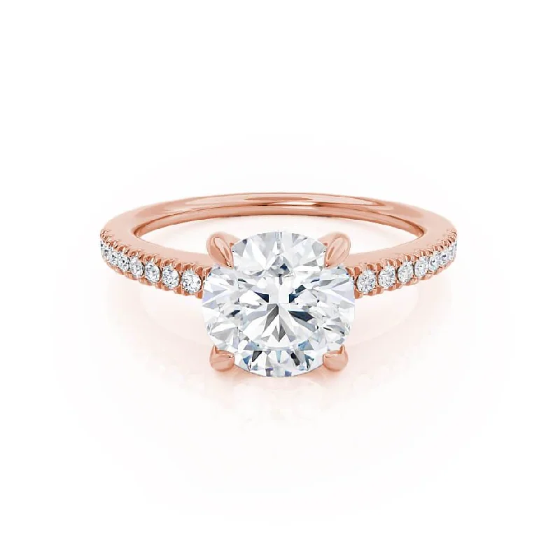 Radiant - cut diamond engagement ring with a bezel - set center stone in 18K yellow goldCATALINA - Round Moissanite 18k Rose Gold Shoulder Set Ring