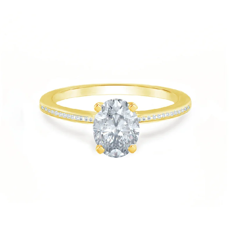 Halo diamond engagement ring in 18K white gold with a center oval - cut stoneIRIS - Oval Moissanite 18k Yellow Gold Petite Channel Set Ring