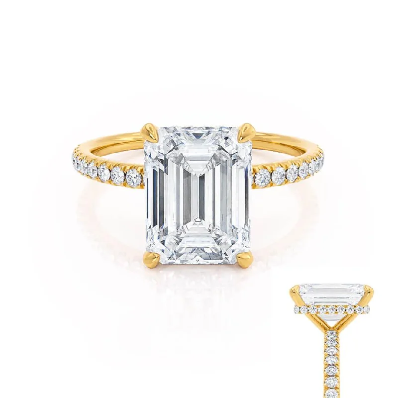 Solitaire diamond engagement ring with a platinum setting for a classic and elegant lookLIVELY - Emerald Moissanite & Diamond 18k Yellow Gold Petite Hidden Halo Pavé Shoulder Set Ring