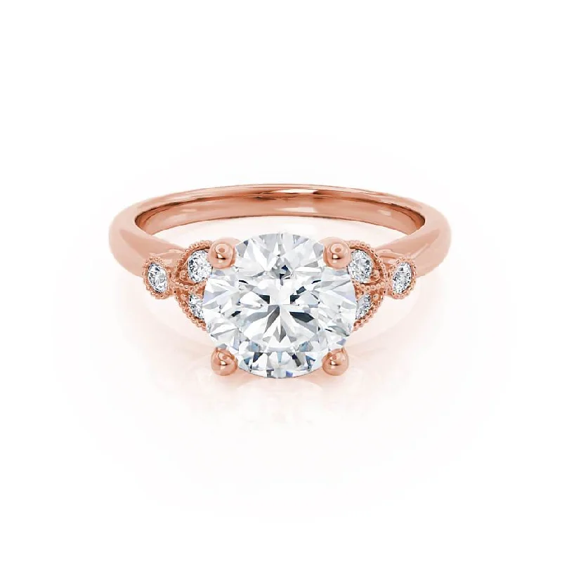 Oval - cut sapphire and diamond engagement ring in 18K white goldDELILAH - Round Moissanite 18k Rose Gold Shoulder Set Ring