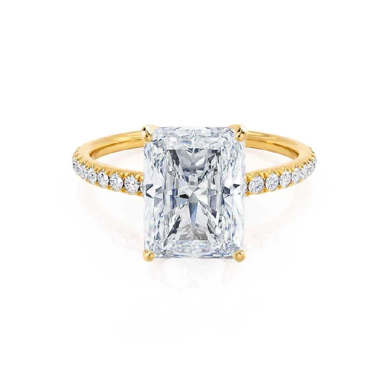 Round - cut diamond engagement ring with a twisted band design in 14K white goldMACY - Radiant Moissanite & Diamond 18k Yellow Gold Petite Pavé Shoulder Set Ring