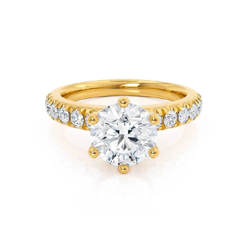 Radiant - cut diamond engagement ring with a bezel - set center stone in 18K yellow goldBELLE - Round Moissanite 18k Yellow Gold Shoulder Set Ring