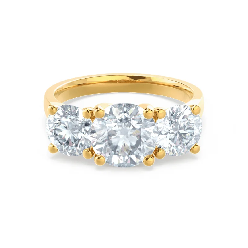 Vintage - style engagement ring with filigree details and sapphire accents in 14K yellow goldLORELLA - Round Moissanite 18k Yellow Gold Trilogy Ring