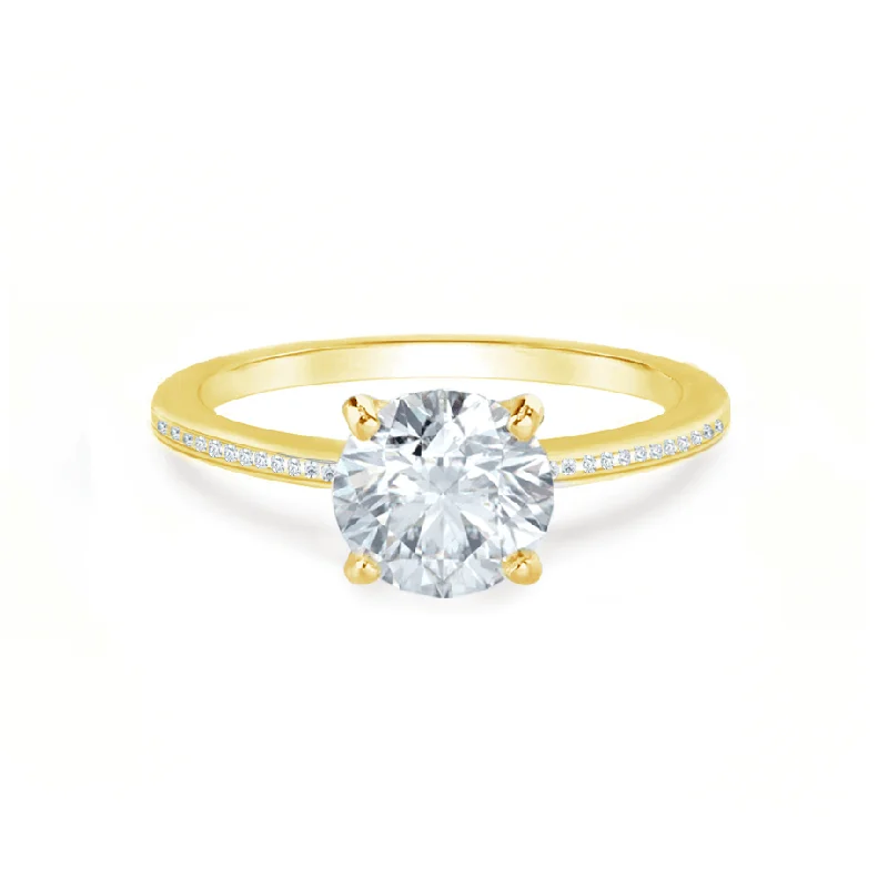 Princess - cut diamond engagement ring with a pavé - set band in platinumIRIS - Round Moissanite 18k Yellow Gold Petite Channel Set Ring