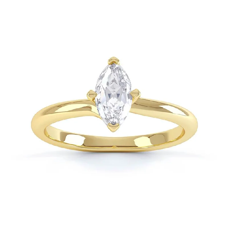 Emerald - cut diamond engagement ring set in a modern titanium bandRAVEN - Marquise Moissanite 18k Yellow Gold Twist Solitaire Ring