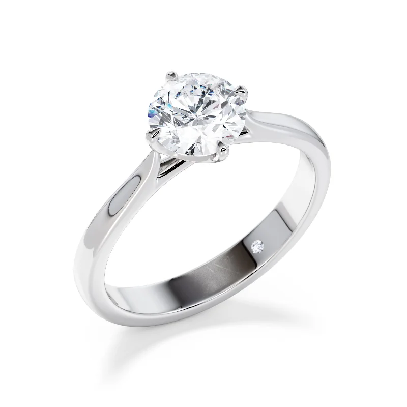 Cushion - cut diamond engagement ring with a halo of moissanite in a silver - plated bandPrimrose