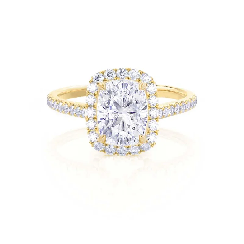 Round - cut diamond engagement ring with a twisted band design in 14K white goldDARLEY - Moissanite Elongated Cushion Micro Pavé 18k Yellow Gold Halo