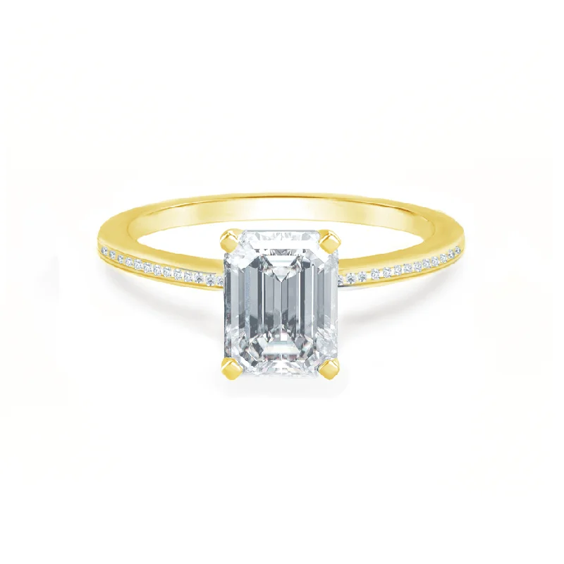 Cushion - cut diamond engagement ring with a halo of moissanite in a silver - plated bandIRIS - Emerald Moissanite 18k Yellow Gold Petite Channel Set Ring