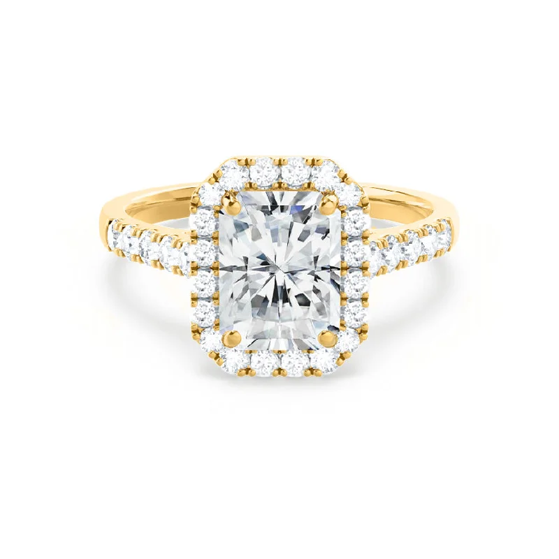 Emerald - cut diamond engagement ring set in a modern titanium bandESME - Radiant Moissanite & Diamond 18k Yellow Gold Halo Rings