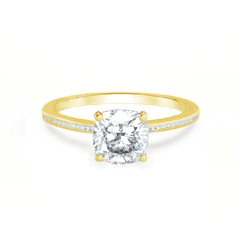 Radiant - cut diamond engagement ring with a bezel - set center stone in 18K yellow goldIRIS - Cushion Moissanite 18k Yellow Gold Petite Channel Set Ring