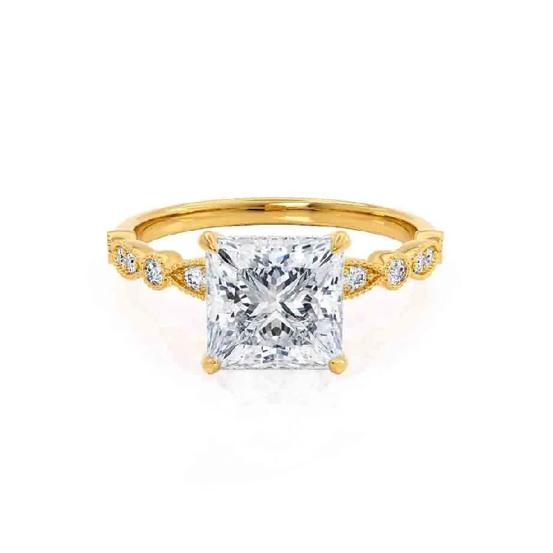 Solitaire diamond engagement ring with a platinum setting for a classic and elegant lookHOPE - Princess Moissanite & Diamond 18k Yellow Gold Vintage Shoulder Set