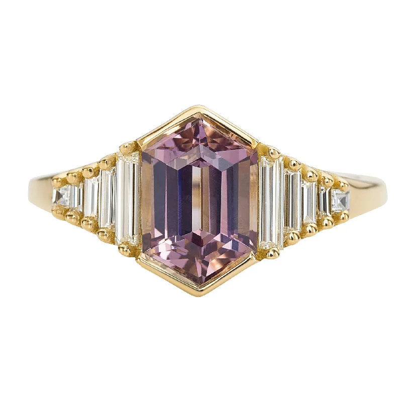 Cluster Engagement Rings with Multiple Small Diamonds Arranged in a Stunning DesignLilac Engagement Ring with an Elongated Hexagon Spinel and Baguette Diamonds